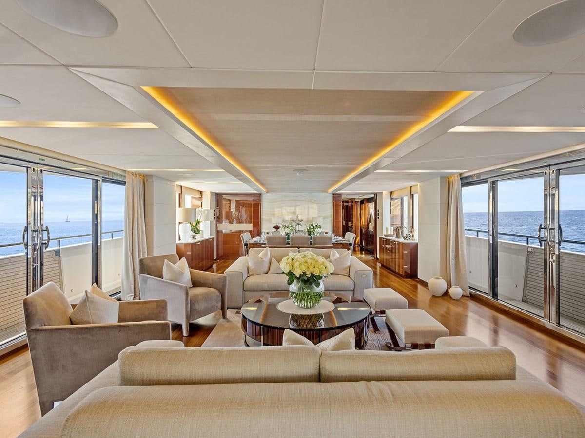 a living room with a large window aboard ACE 2 Yacht for Sale