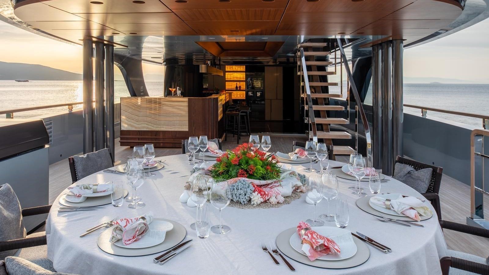 a table set for a dinner aboard GECO Yacht for Sale