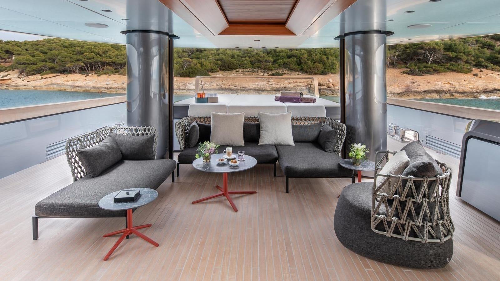 a living room with a large patio aboard GECO Yacht for Sale