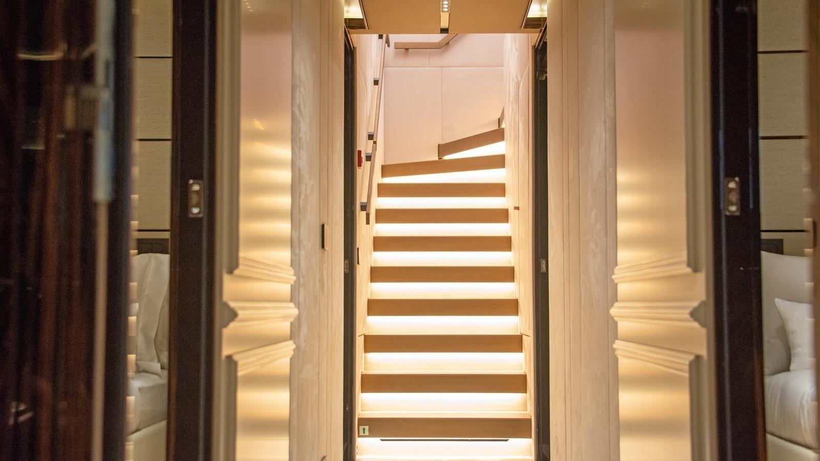 a white staircase in a room aboard GECO Yacht for Sale