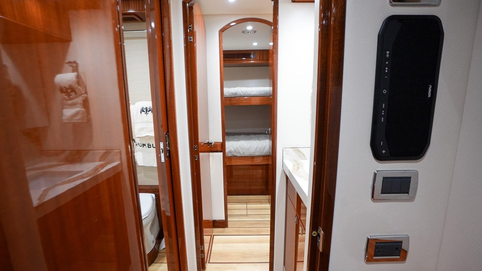 a room with a mirror and a bed aboard GT 70 Yacht for Sale