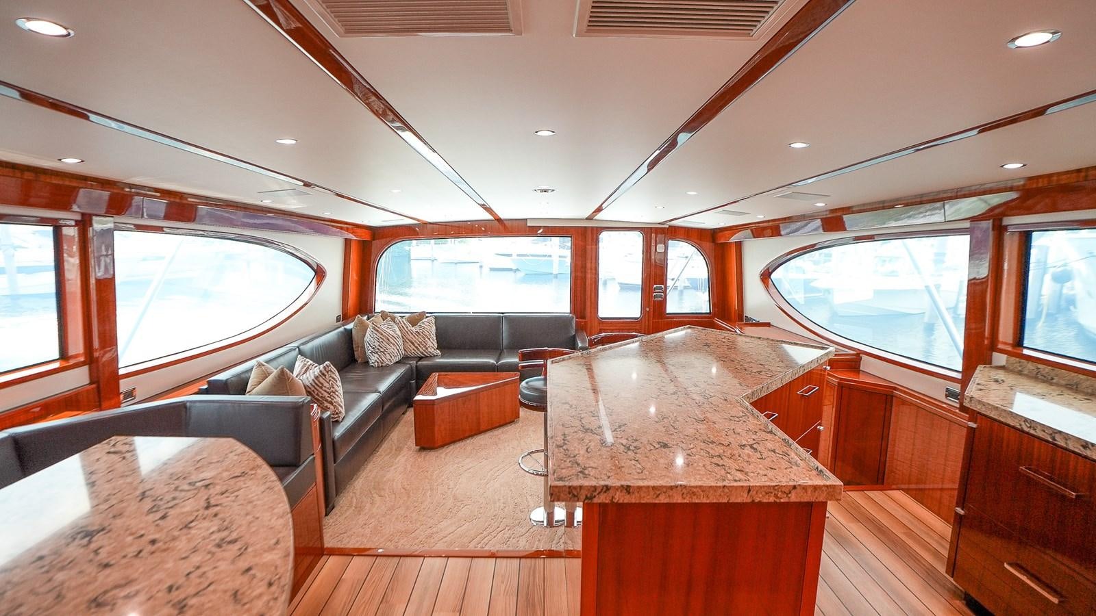 a living room with a couch and a table aboard GT 70 Yacht for Sale