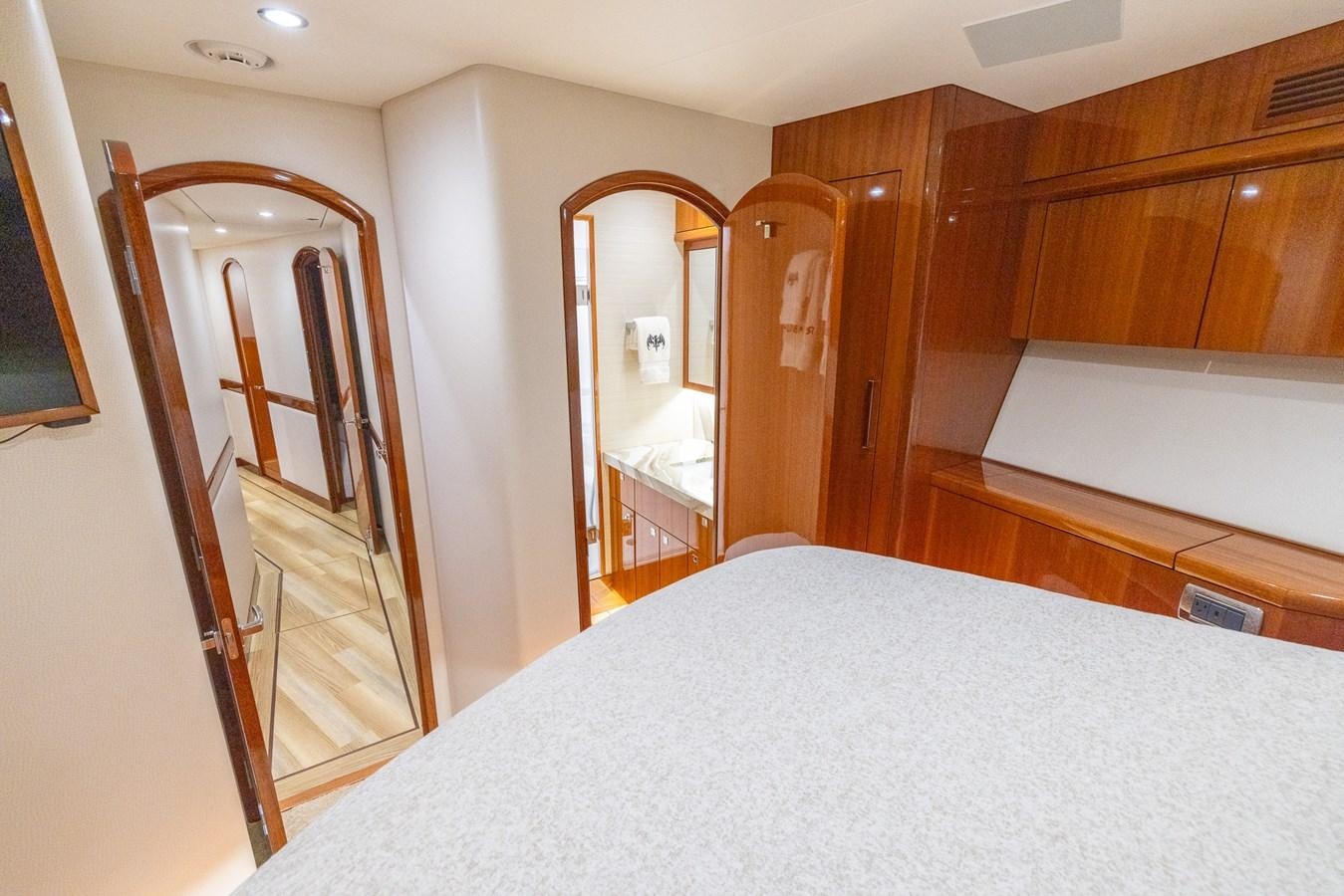 a bedroom with a large mirror aboard GT 70 Yacht for Sale
