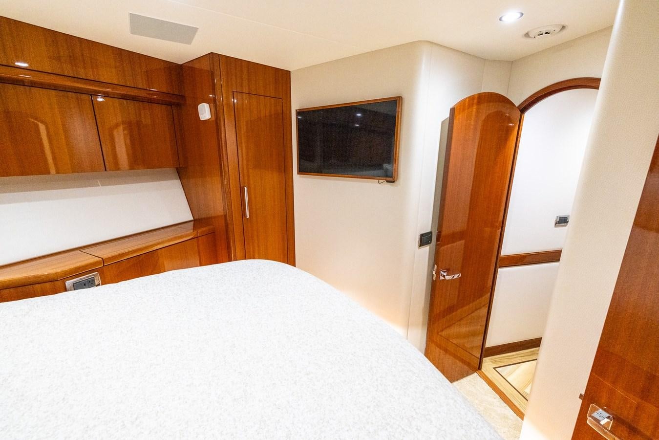 a bedroom with a bed and closet aboard GT 70 Yacht for Sale