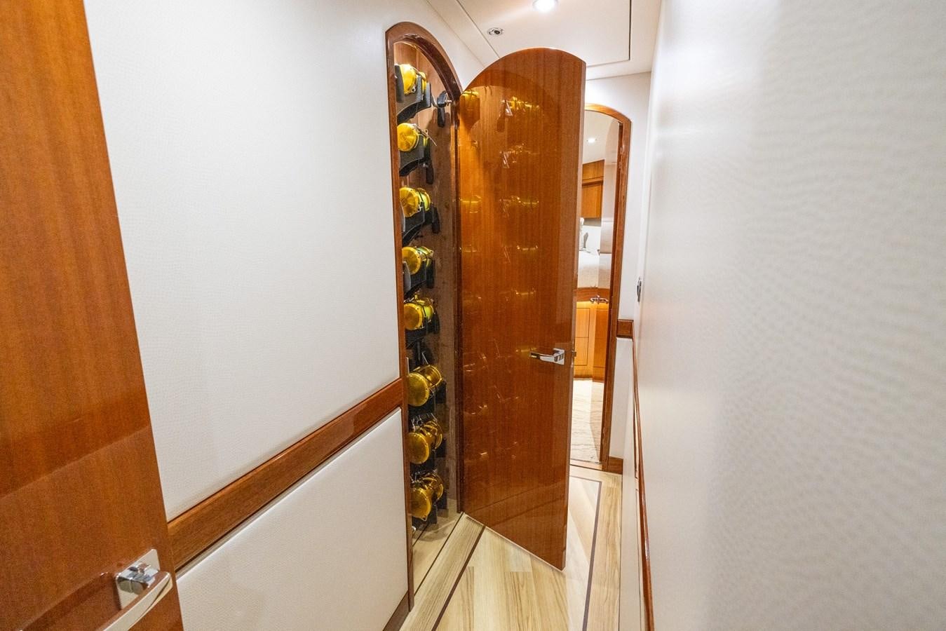 a room with a door and a mirror aboard GT 70 Yacht for Sale