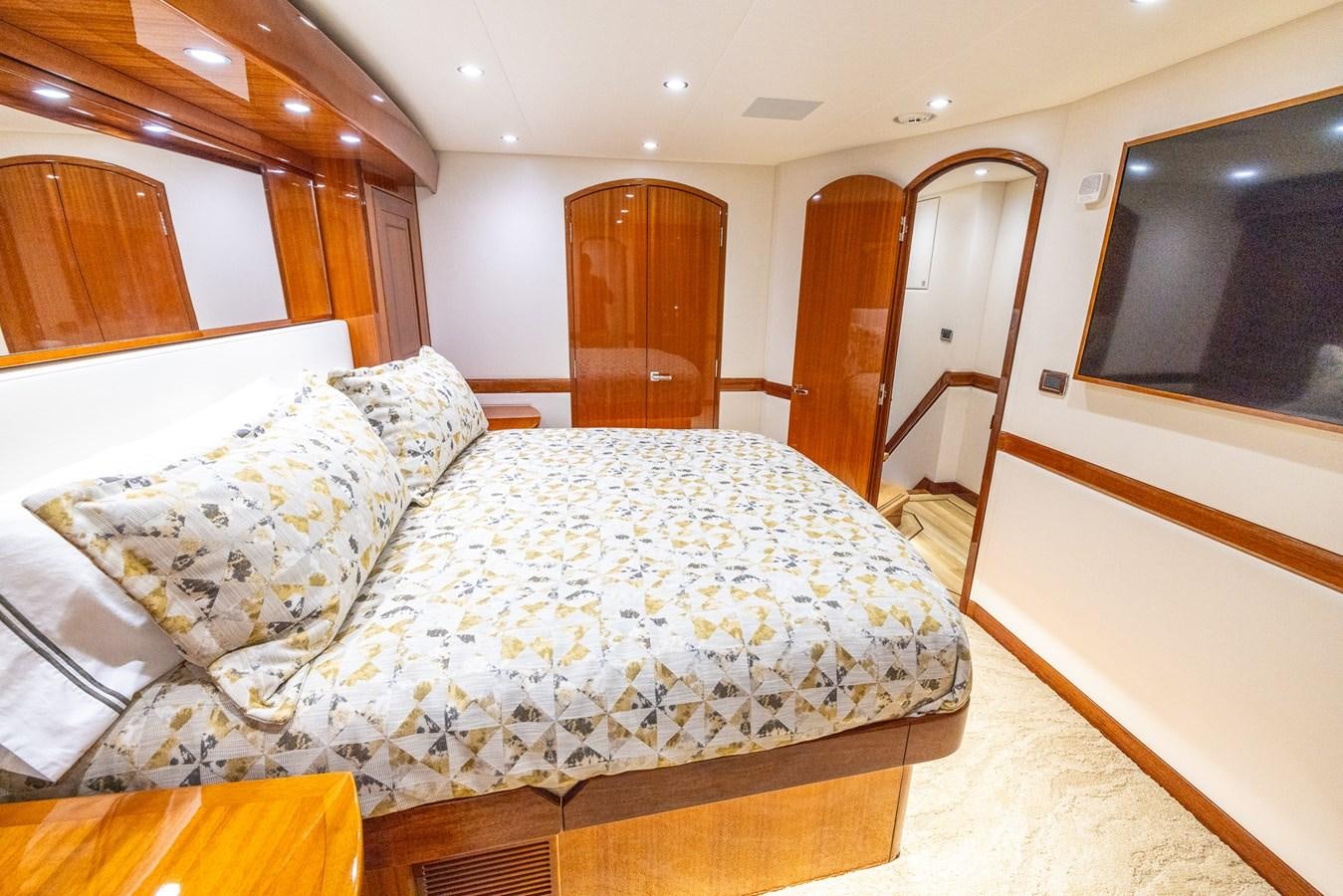a bedroom with a large bed aboard GT 70 Yacht for Sale