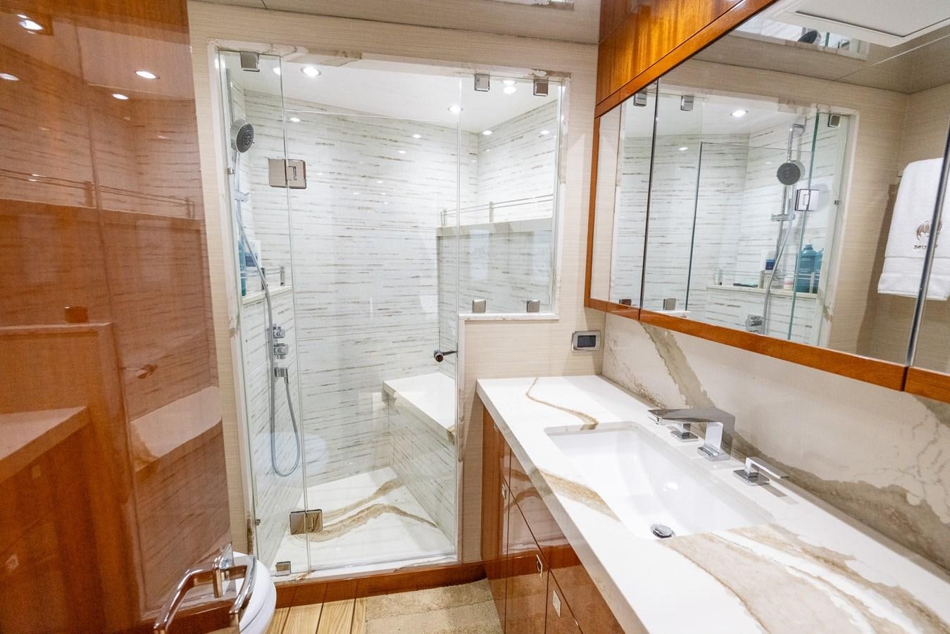 a bathroom with a large mirror aboard GT 70 Yacht for Sale