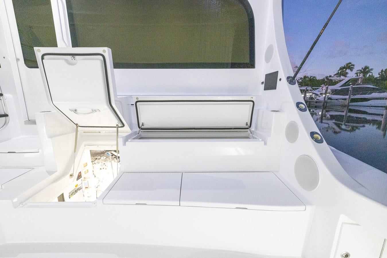 a white boat with a door open aboard GT 70 Yacht for Sale