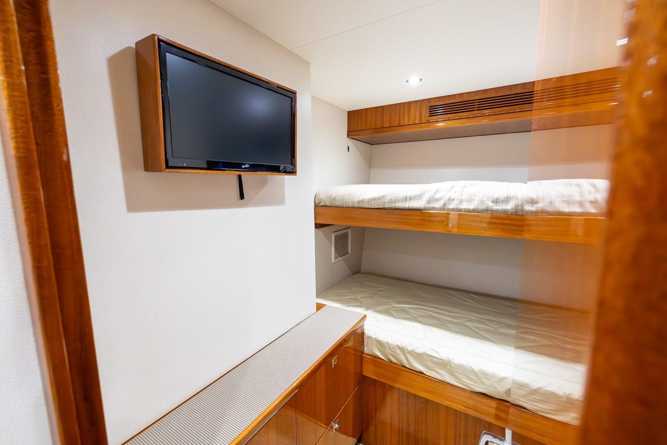 a tv on a wall aboard GT 70 Yacht for Sale