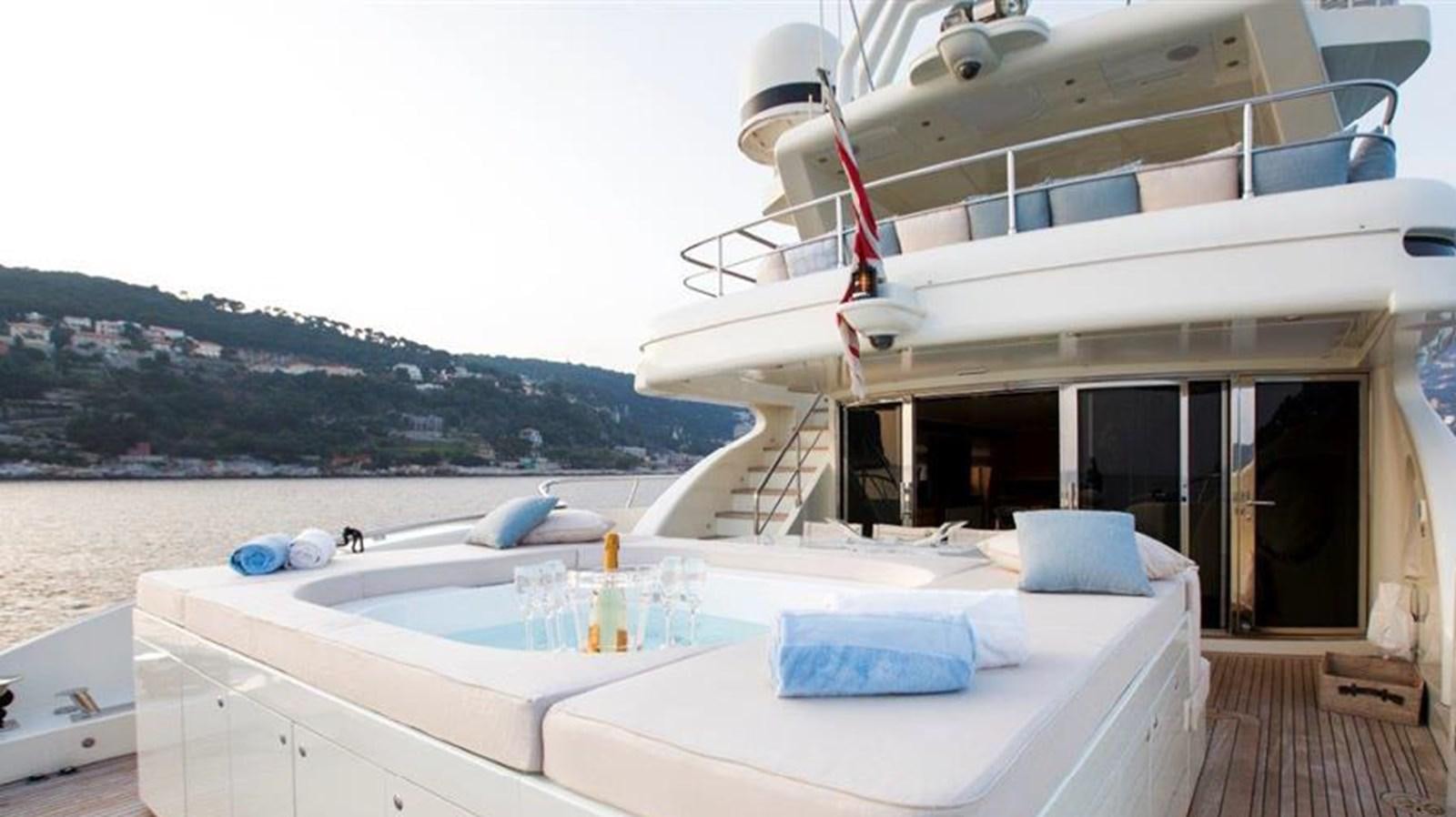 a large white boat on a beach aboard LIBERDADE Yacht for Sale