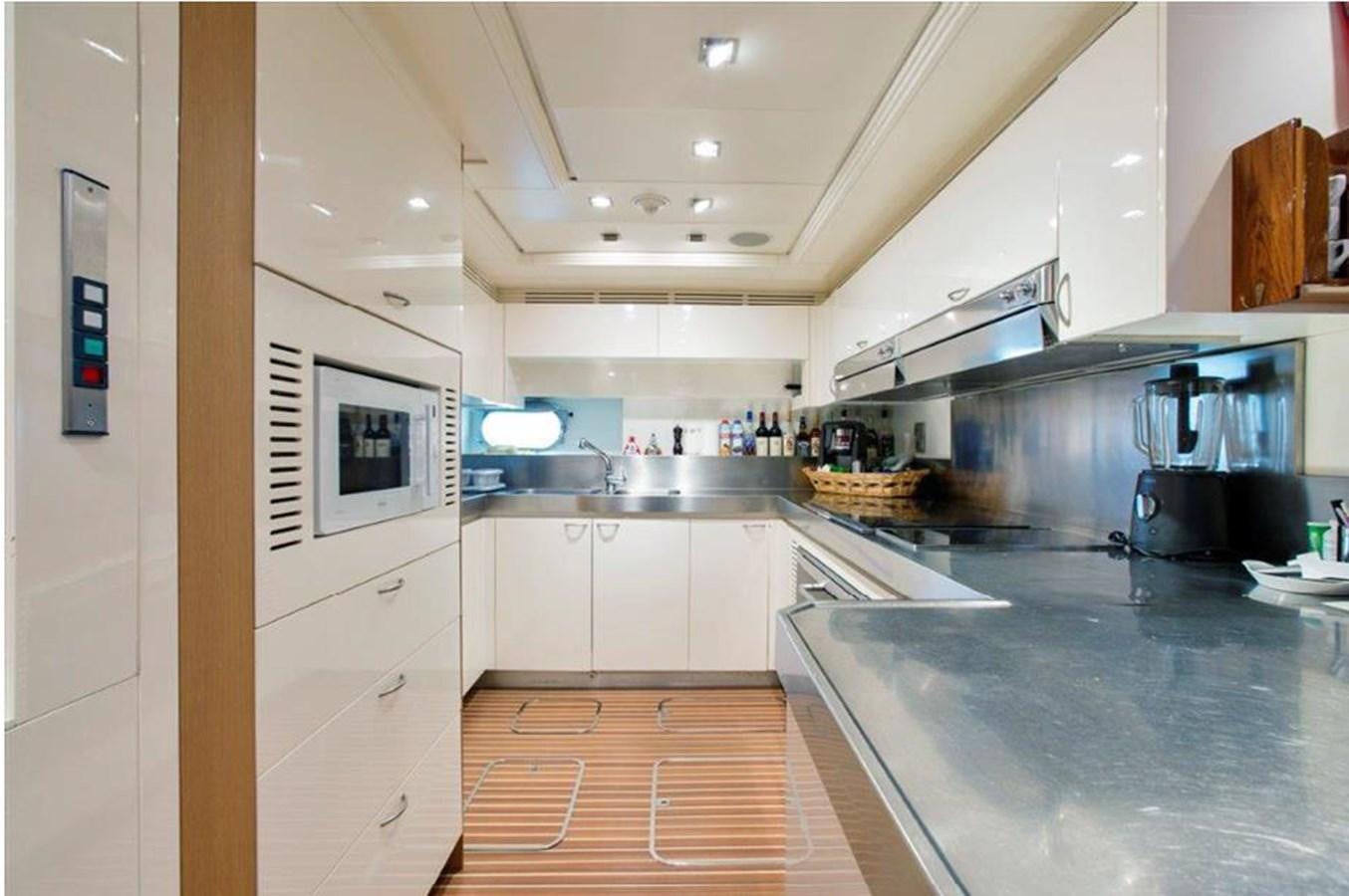 a kitchen with a large island aboard LIBERDADE Yacht for Sale