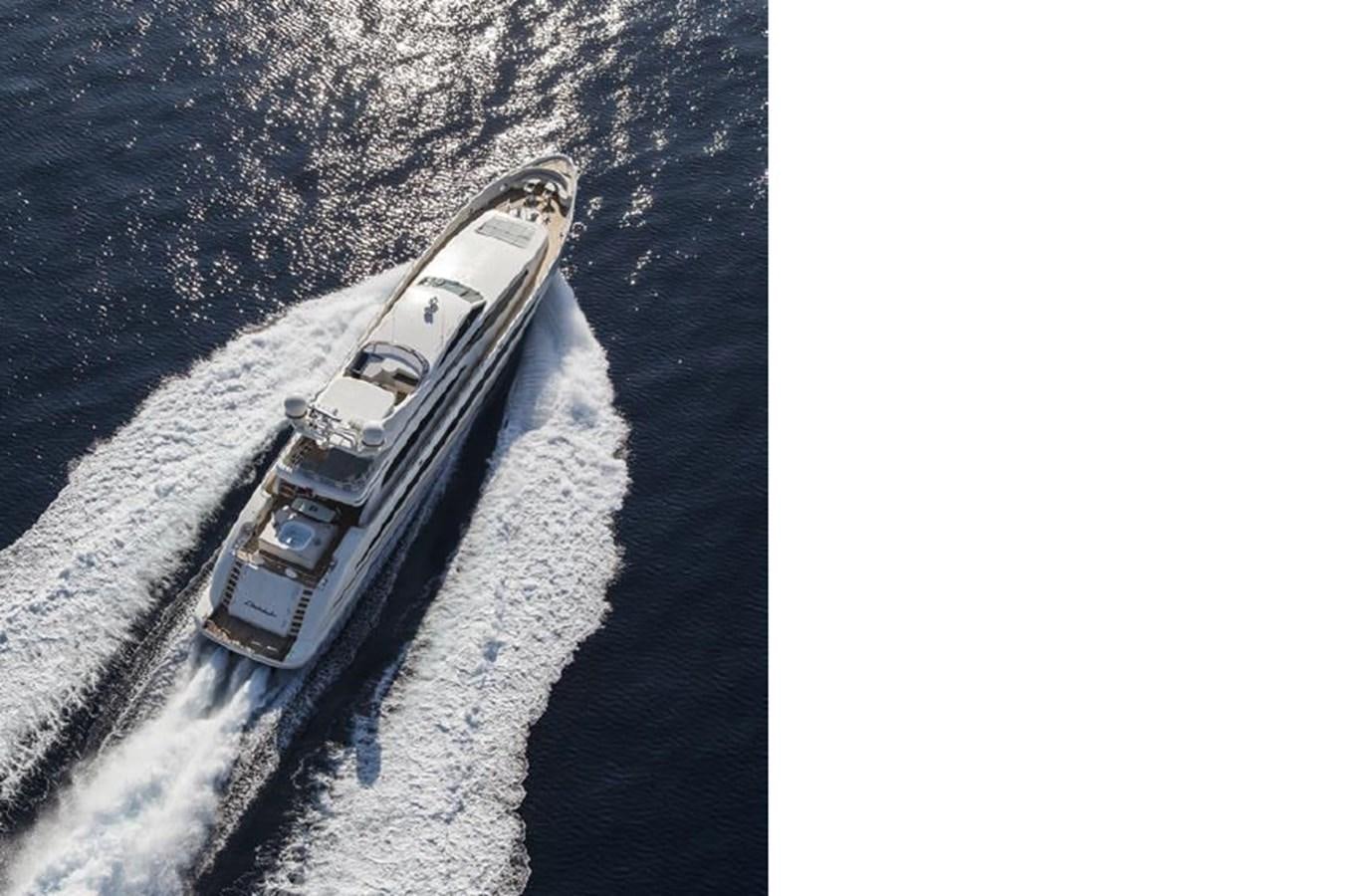 a military vehicle driving on a road aboard LIBERDADE Yacht for Sale