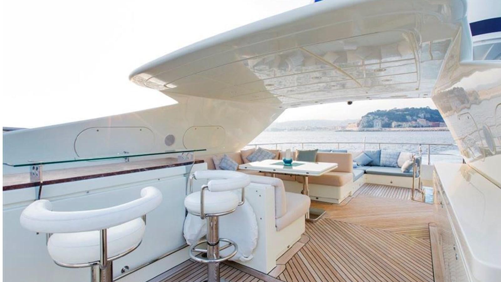 a room with a view of the ocean and a boat aboard LIBERDADE Yacht for Sale