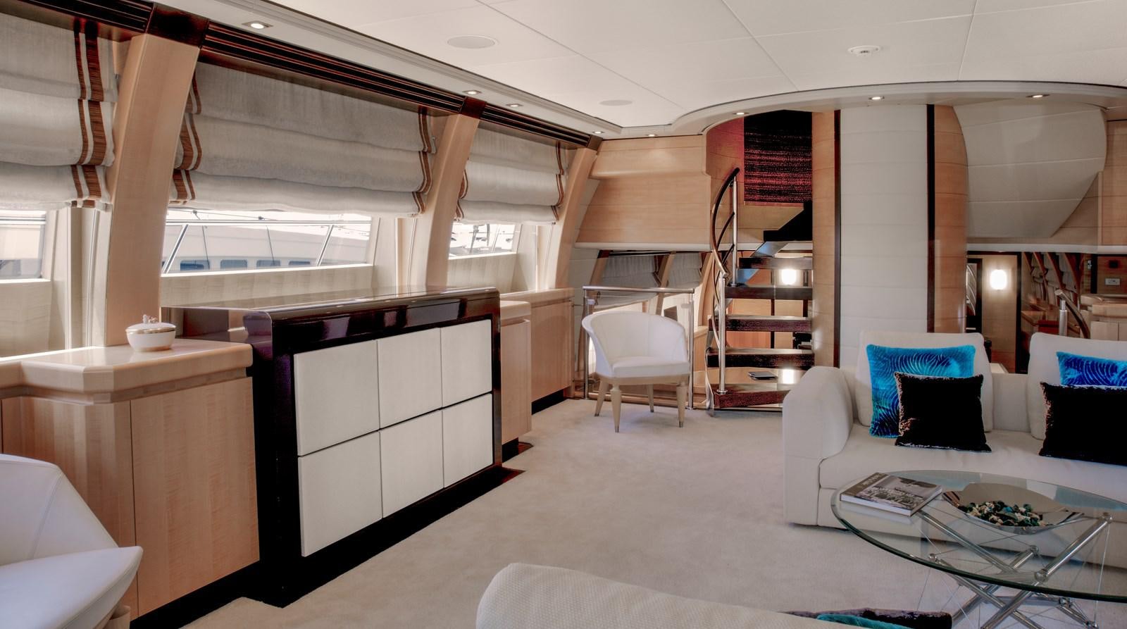 a room with a white couch and a ladder aboard LIBERDADE Yacht for Sale