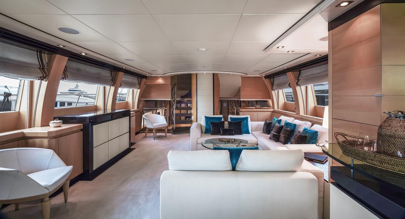 a room with couches and tables aboard LIBERDADE Yacht for Sale