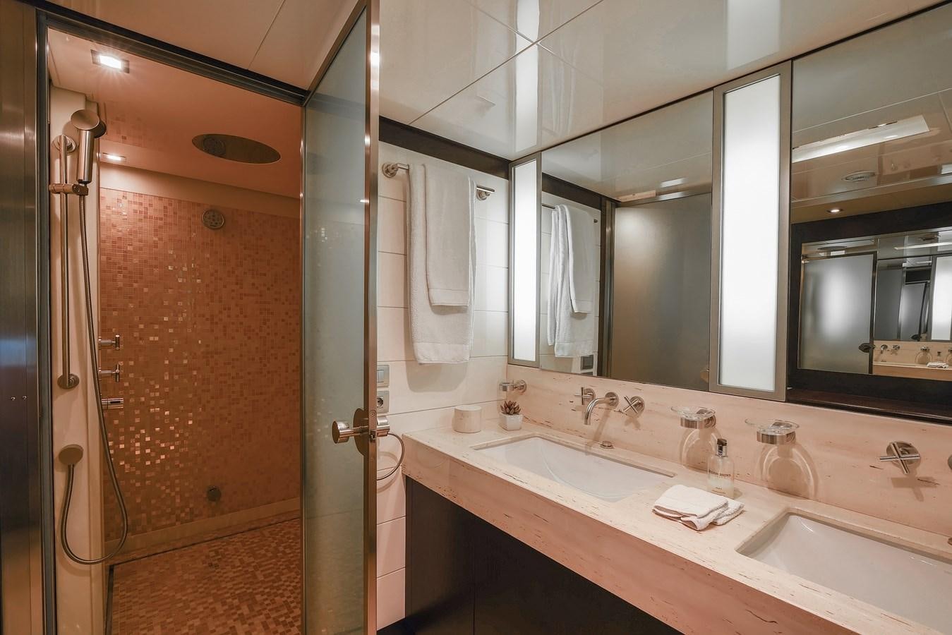 a bathroom with a large mirror aboard LIBERDADE Yacht for Sale