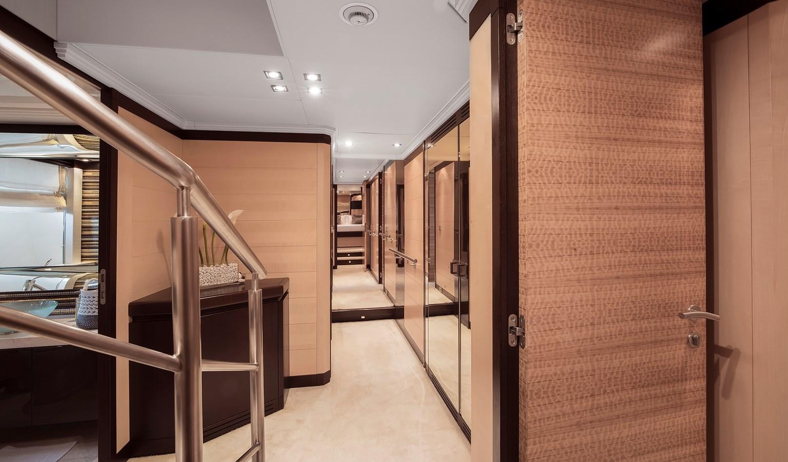 a hallway with doors and railings aboard LIBERDADE Yacht for Sale