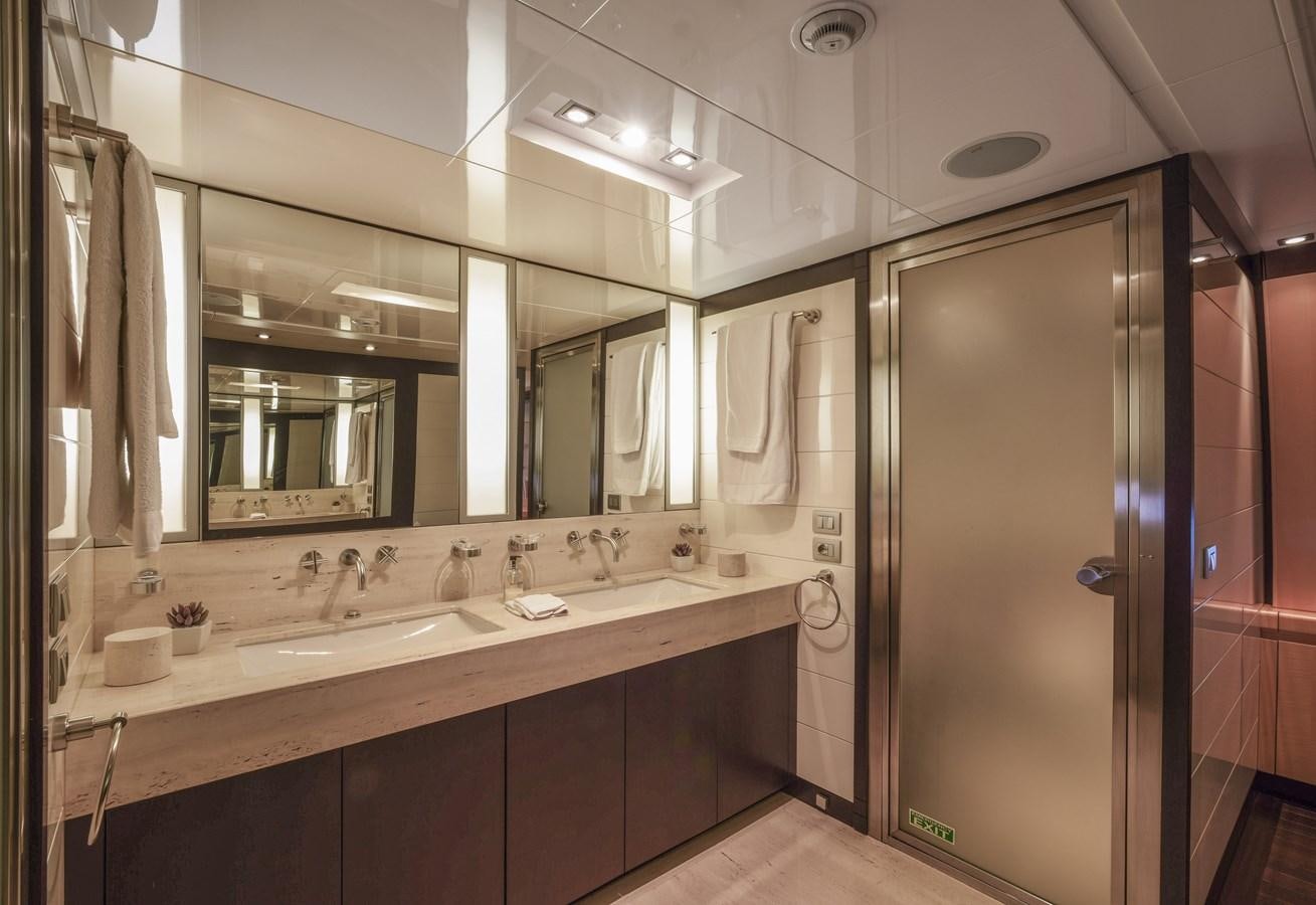 a bathroom with a large mirror aboard LIBERDADE Yacht for Sale