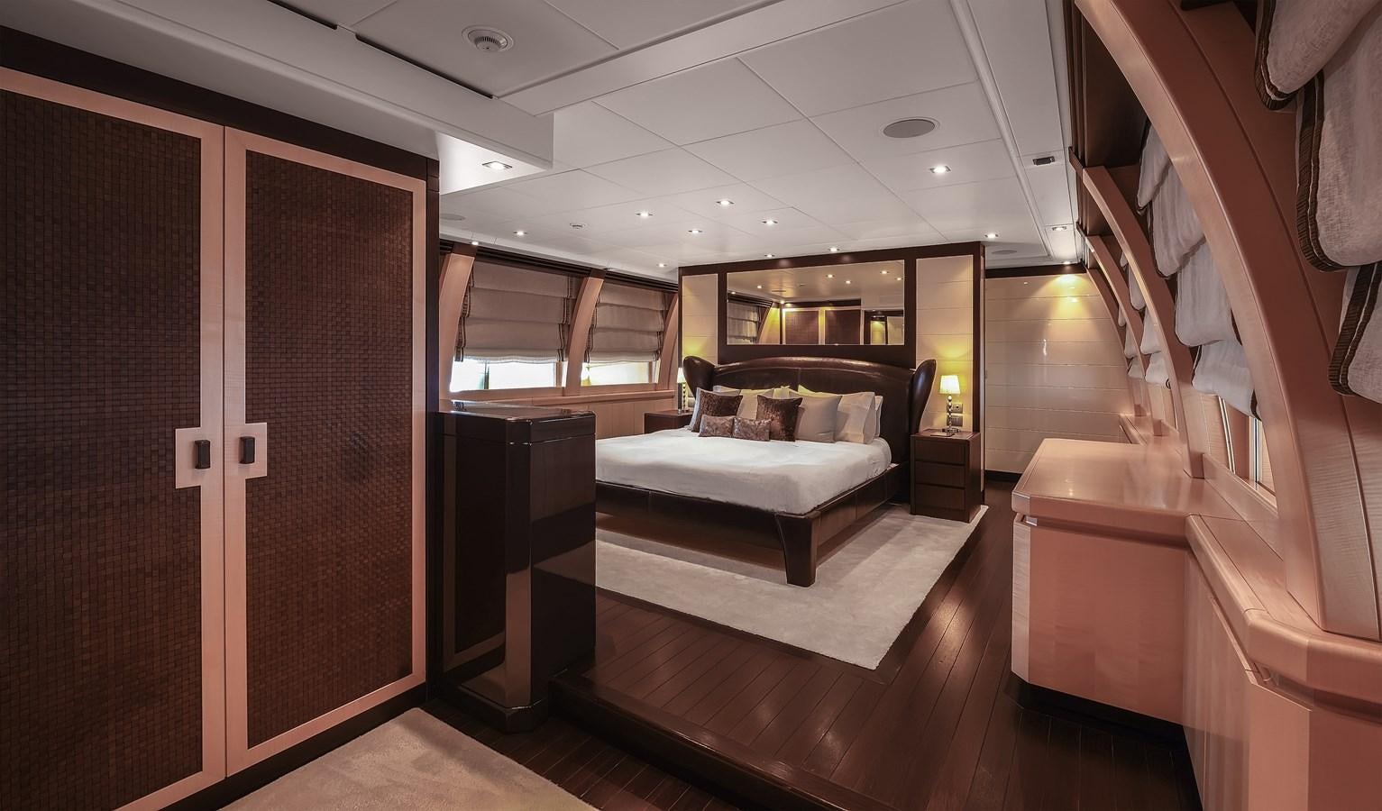 a room with a bed and a couch aboard LIBERDADE Yacht for Sale