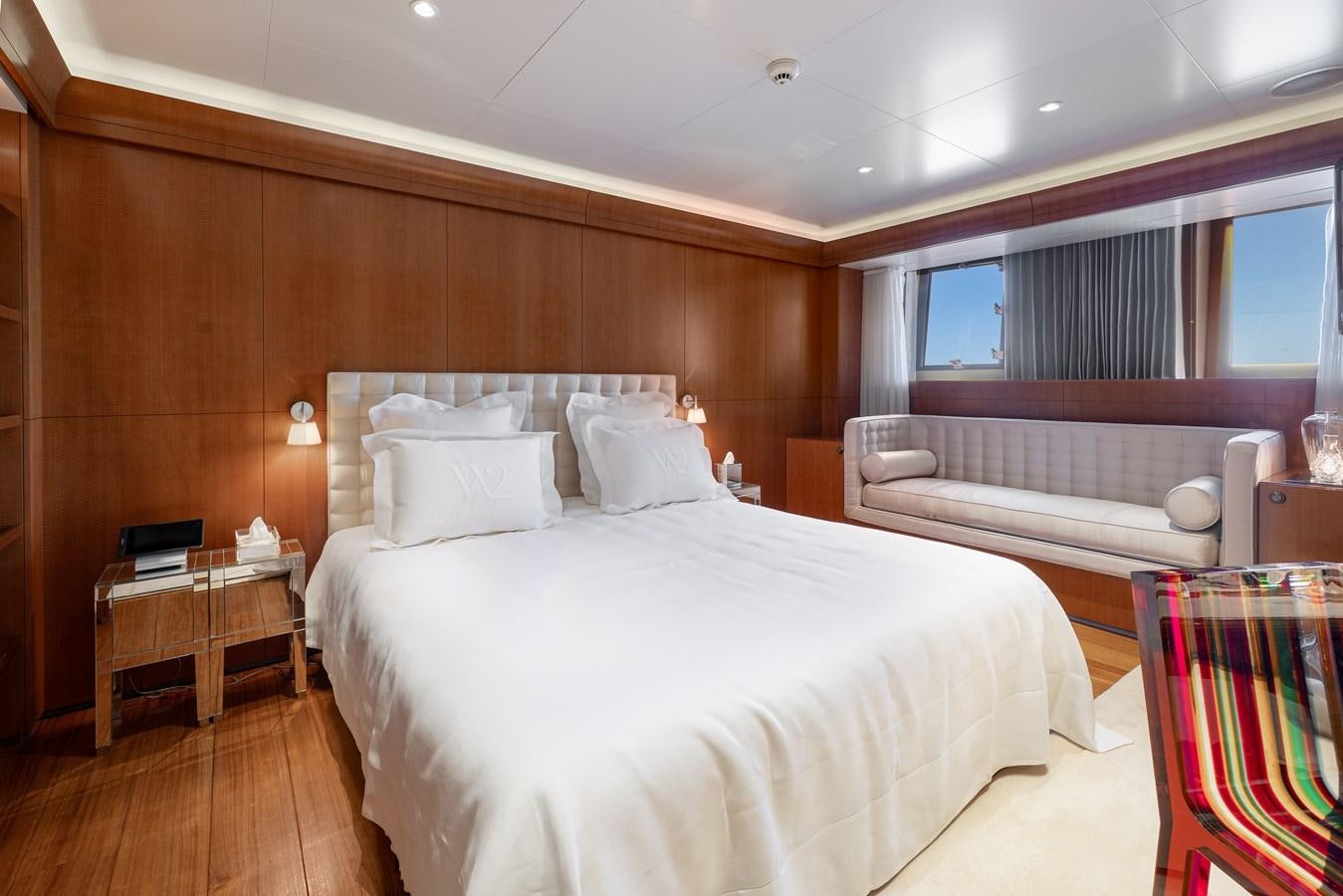 a room with a bed and a desk aboard WEDGE TOO Yacht for Sale
