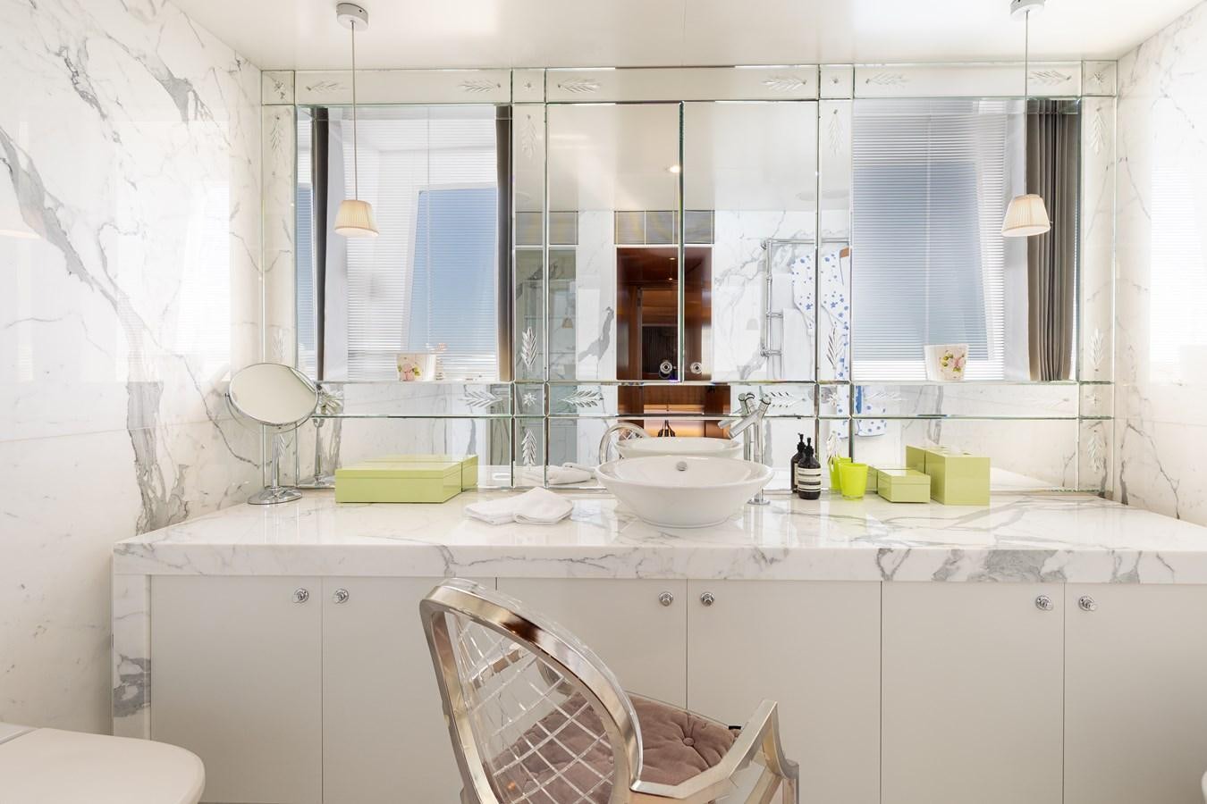 a bathroom with a sink and mirror aboard WEDGE TOO Yacht for Sale