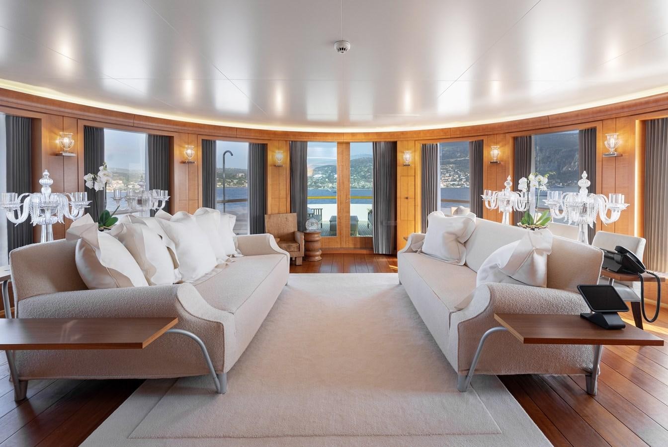 a living room with a couch and a table aboard WEDGE TOO Yacht for Sale