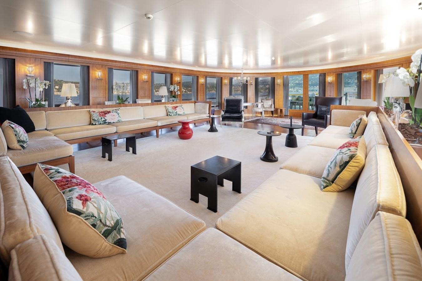 a living room with couches and a coffee table aboard WEDGE TOO Yacht for Sale