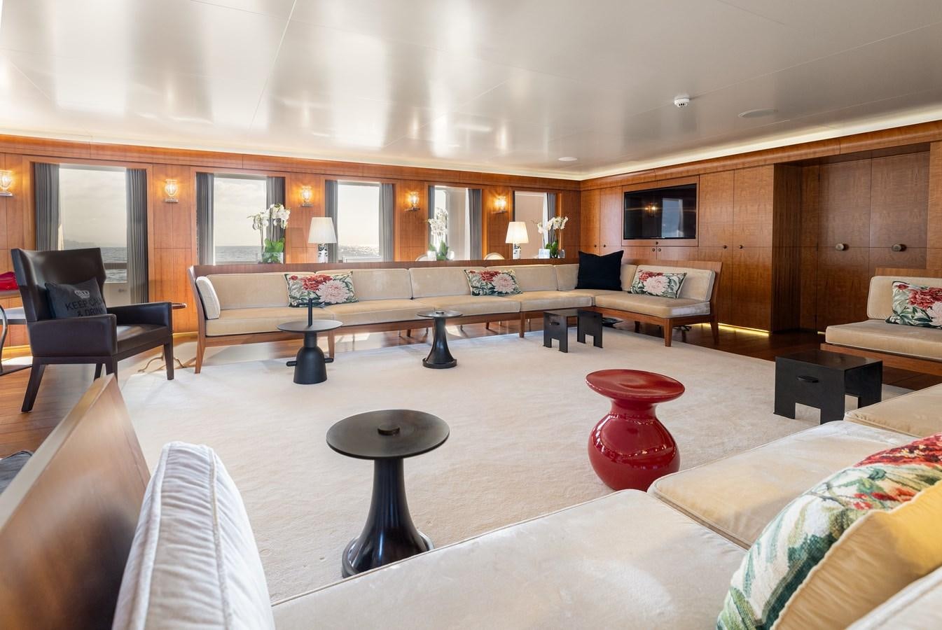 a large room with a table and chairs aboard WEDGE TOO Yacht for Sale