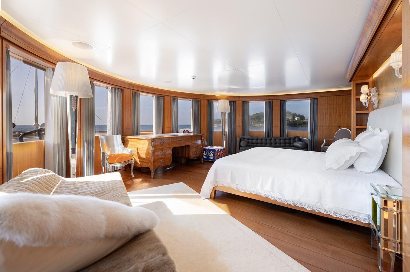 a bedroom with a bed and a desk aboard WEDGE TOO Yacht for Sale