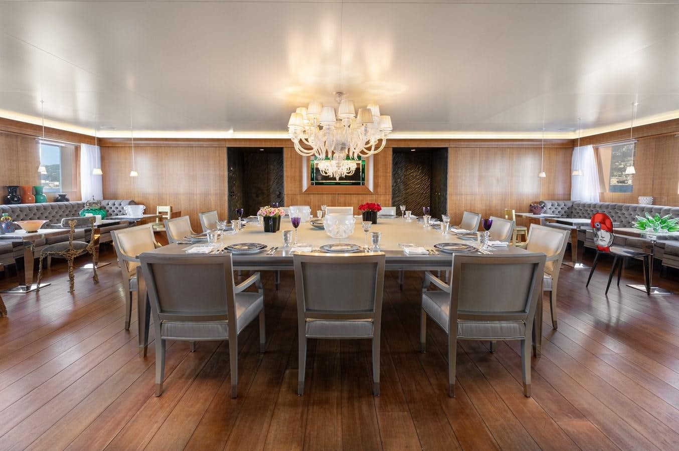 a large room with tables and chairs aboard WEDGE TOO Yacht for Sale