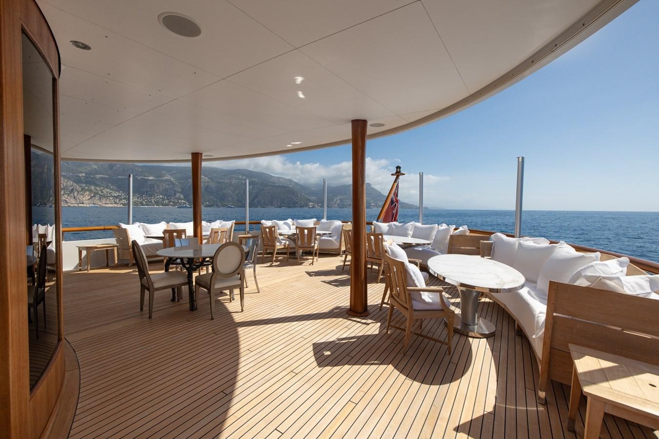 a room with tables and chairs aboard WEDGE TOO Yacht for Sale