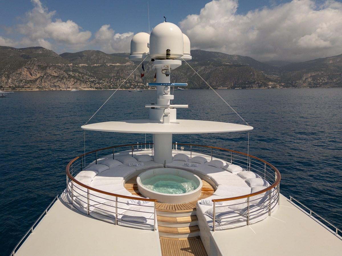 a boat with a white tower on the water aboard WEDGE TOO Yacht for Sale