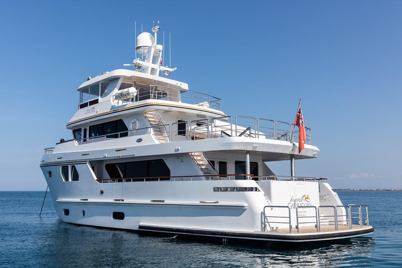 a large white boat in the water aboard BEYOND CAPRICORN Yacht for Sale