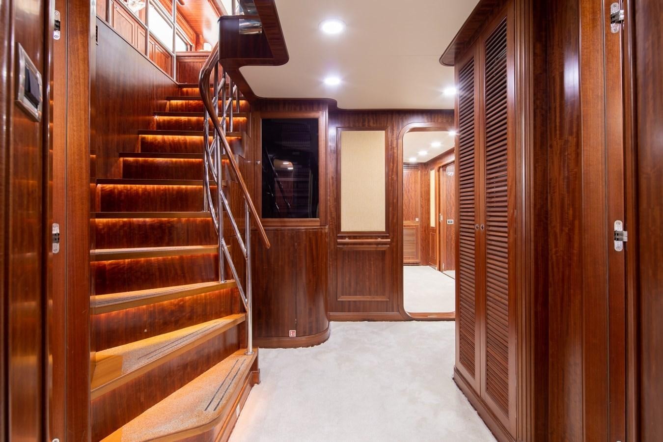 a hallway with wooden doors aboard BEYOND CAPRICORN Yacht for Sale