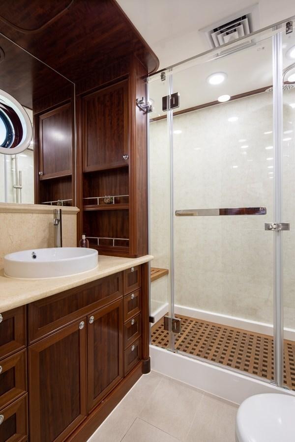 a bathroom with a shower unit and sink aboard BEYOND CAPRICORN Yacht for Sale