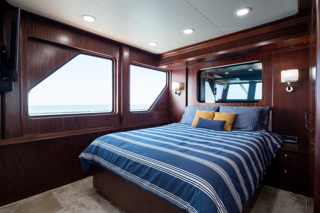 a bed in a room aboard BEYOND CAPRICORN Yacht for Sale