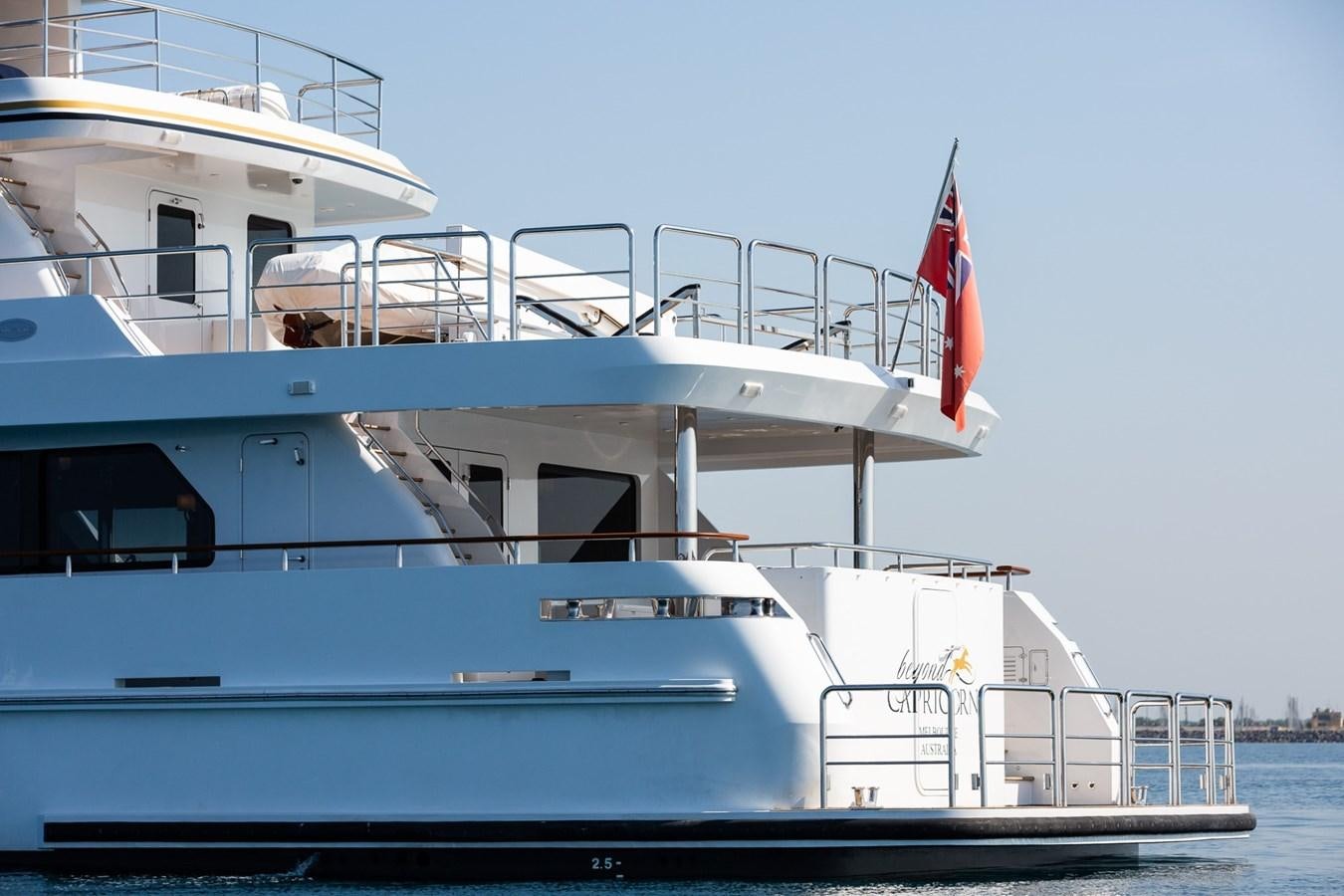 a large boat on the water aboard BEYOND CAPRICORN Yacht for Sale