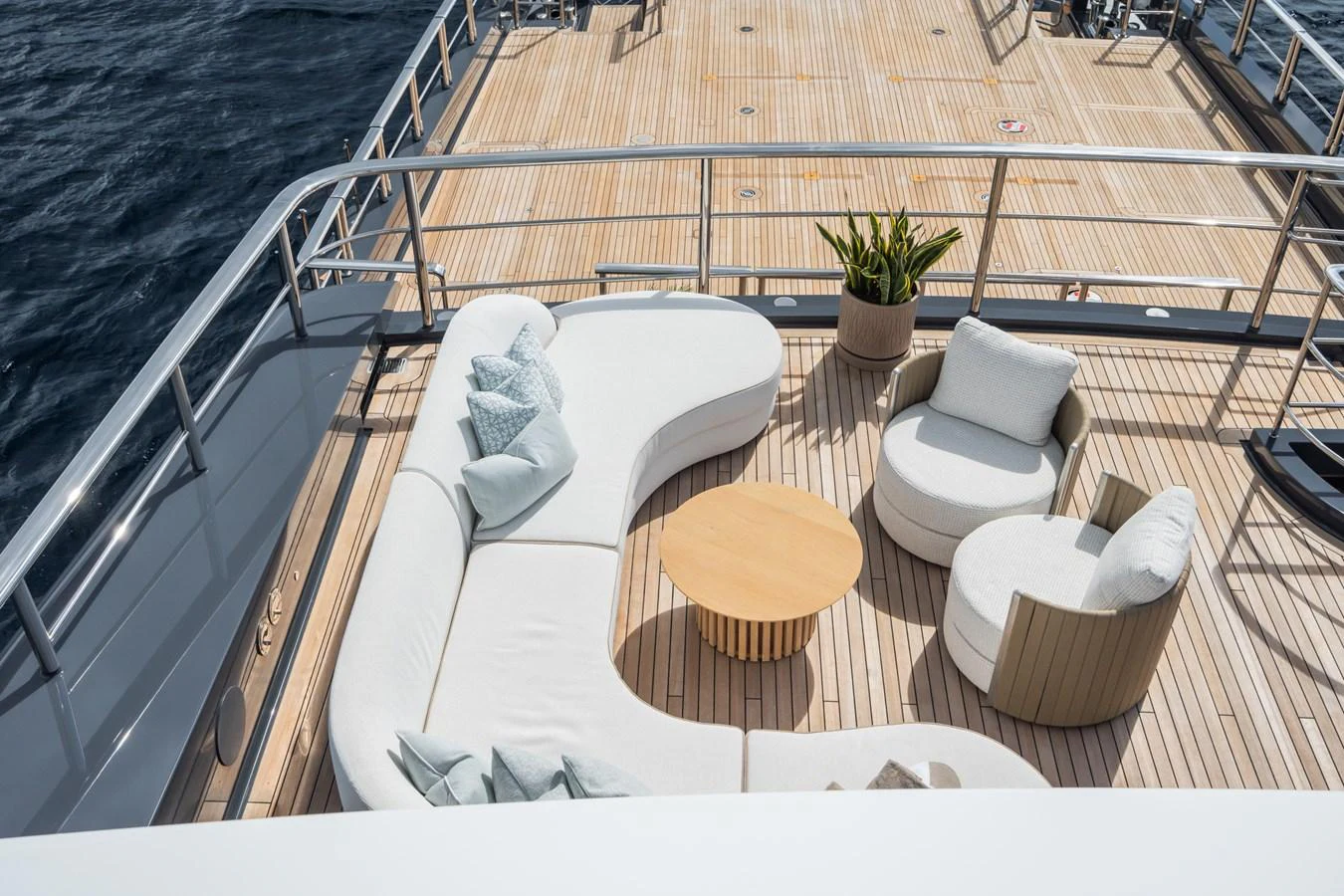 a deck with chairs and a table aboard M Yacht for Sale