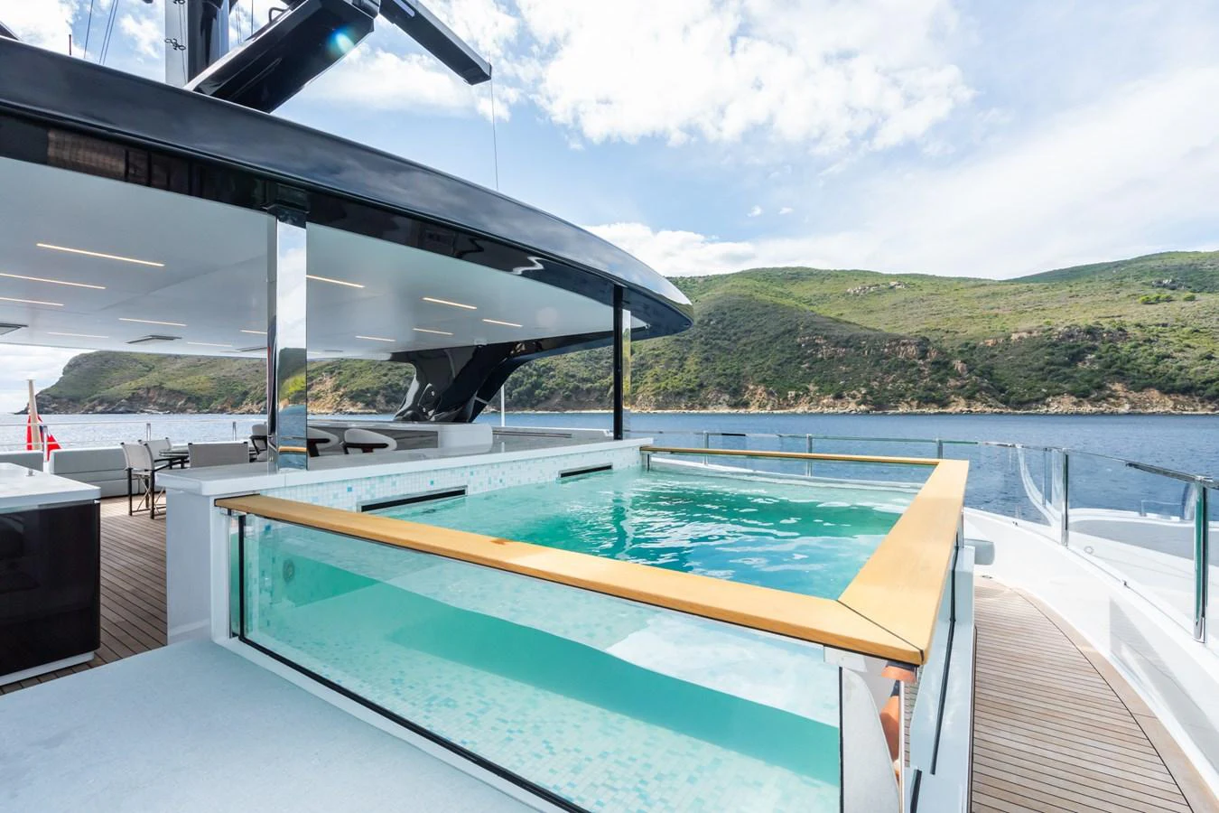 a swimming pool on a deck aboard M Yacht for Sale
