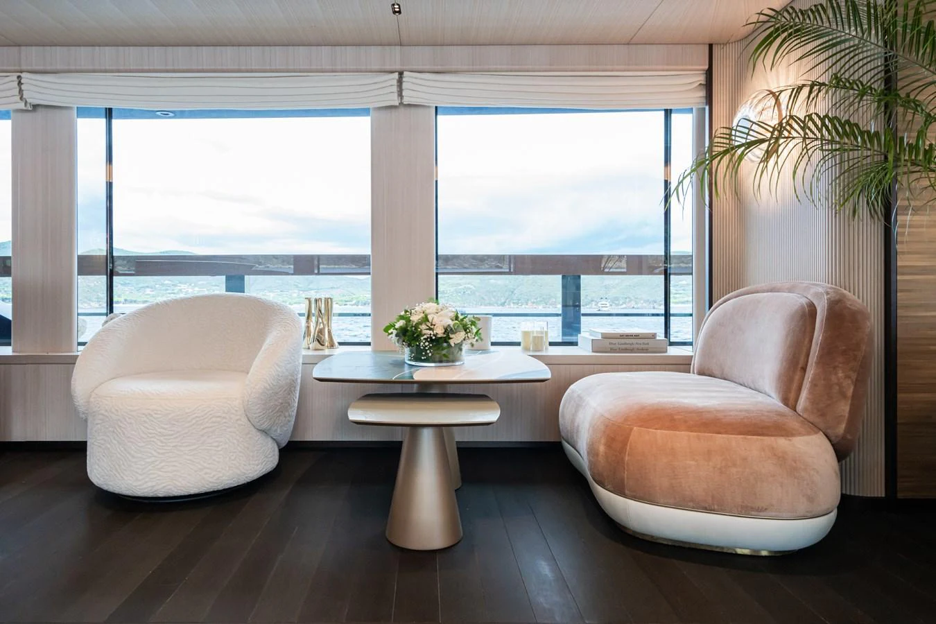 a room with a table and chairs aboard M Yacht for Sale