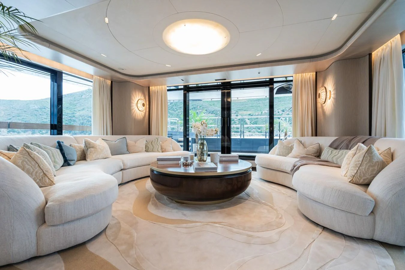 a living room with a large window aboard M Yacht for Sale