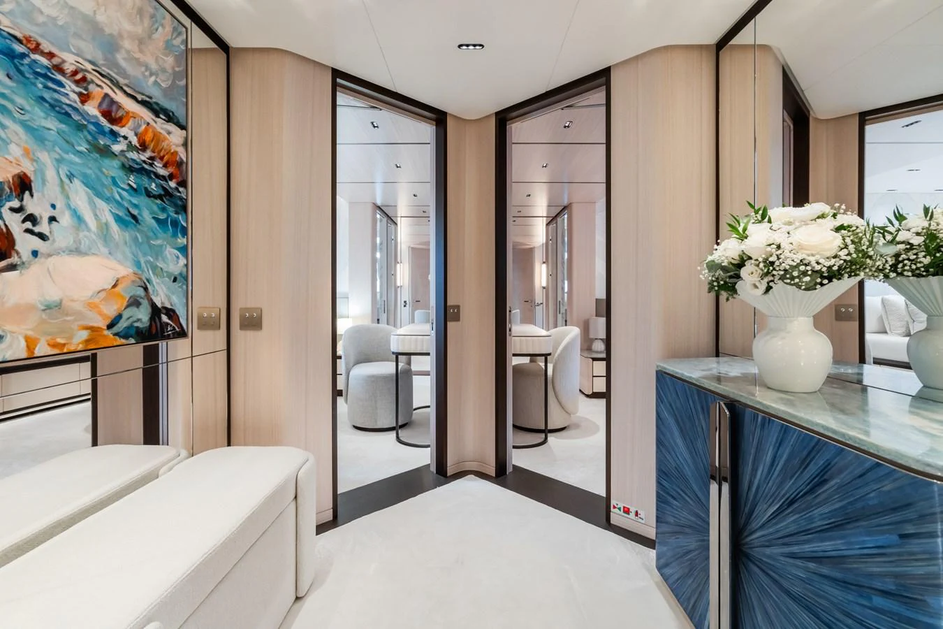 a room with a blue counter and white furniture aboard M Yacht for Sale