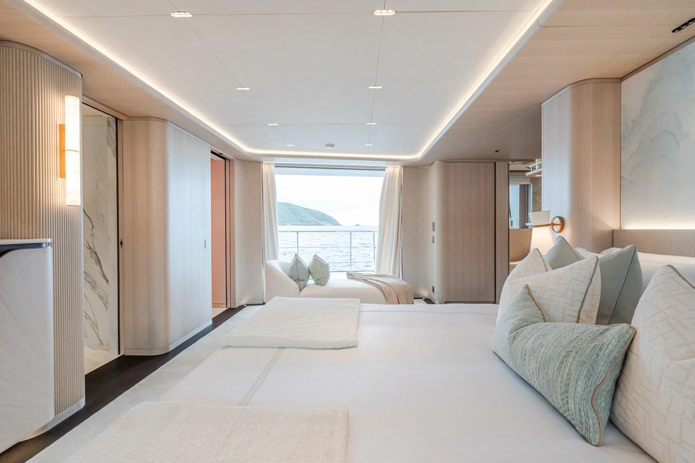 a large bed in a room aboard M Yacht for Sale