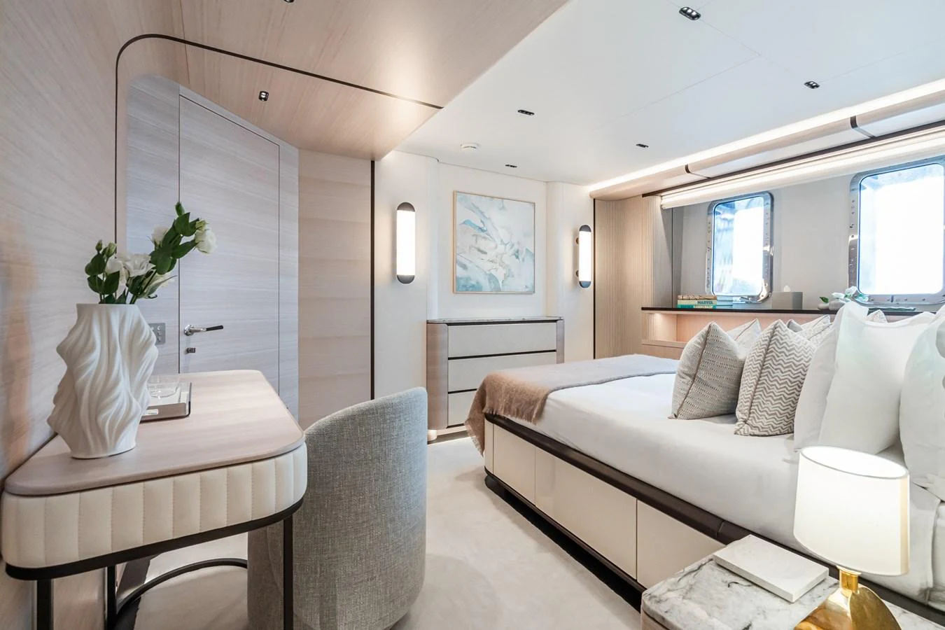 a living room with a white couch and a table aboard M Yacht for Sale