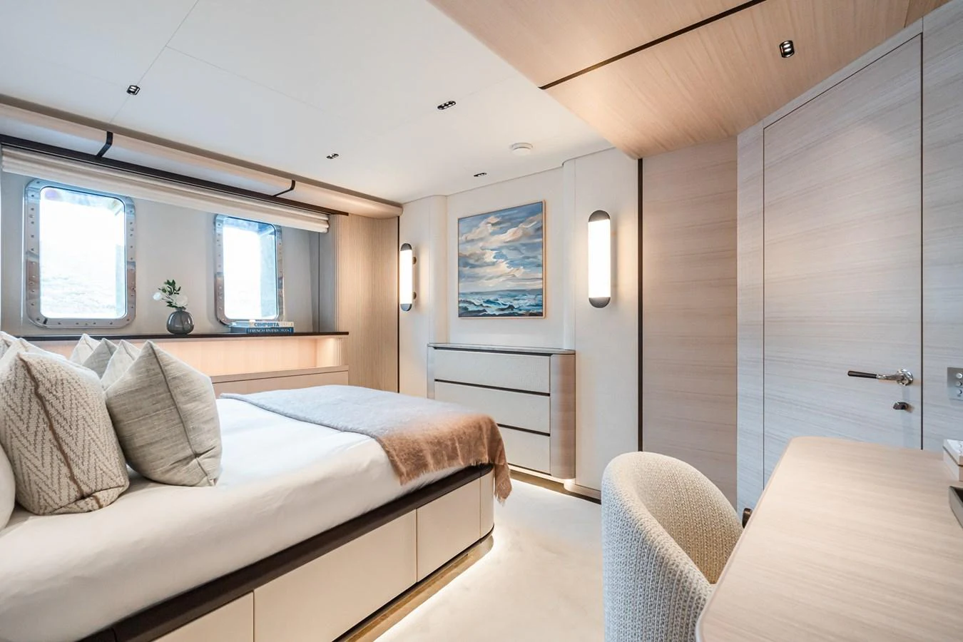 a bedroom with a bed and a desk aboard M Yacht for Sale