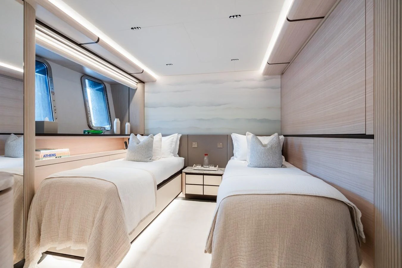 a room with beds and a tv aboard M Yacht for Sale