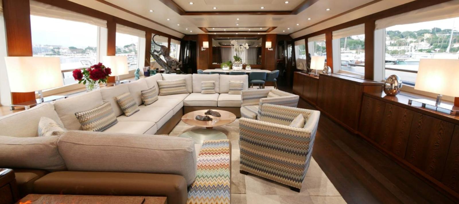 a living room with a couch and a table aboard ASCENSION Yacht for Sale