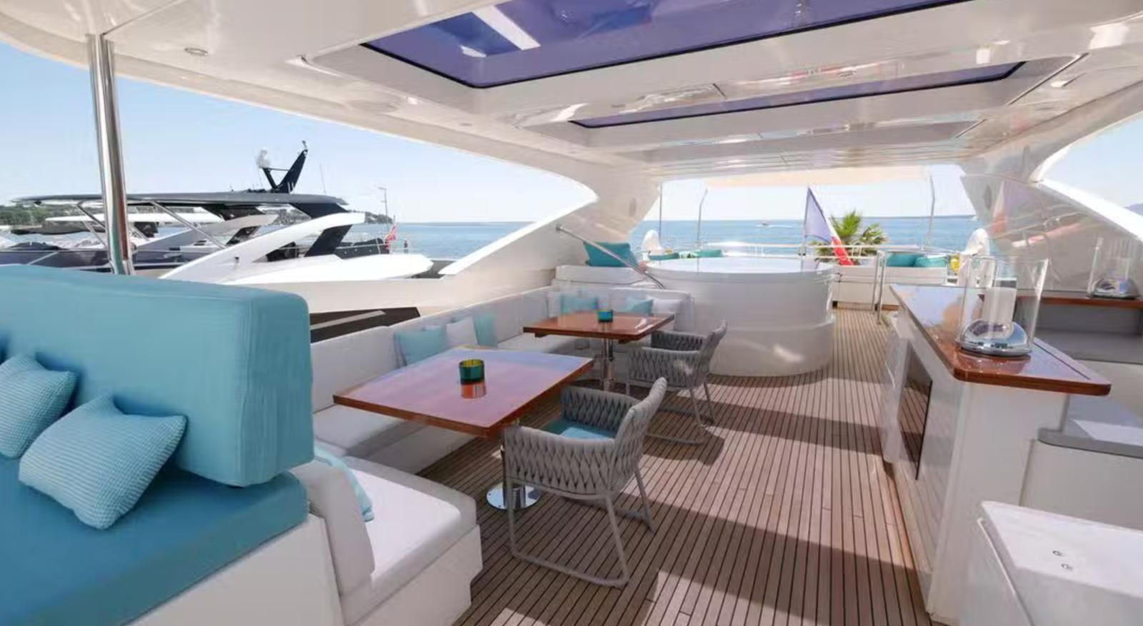 a boat with a table and chairs aboard ASCENSION Yacht for Sale