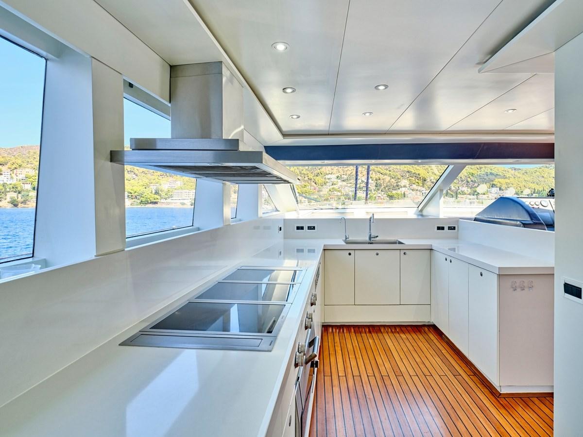 a kitchen with a large island aboard BOOBALE Yacht for Sale