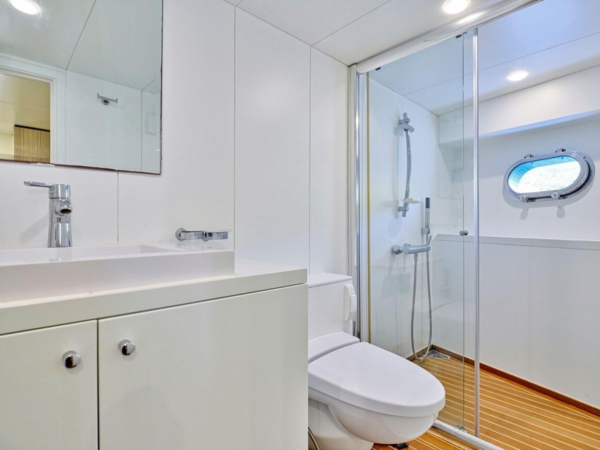 a bathroom with a glass shower aboard BOOBALE Yacht for Sale